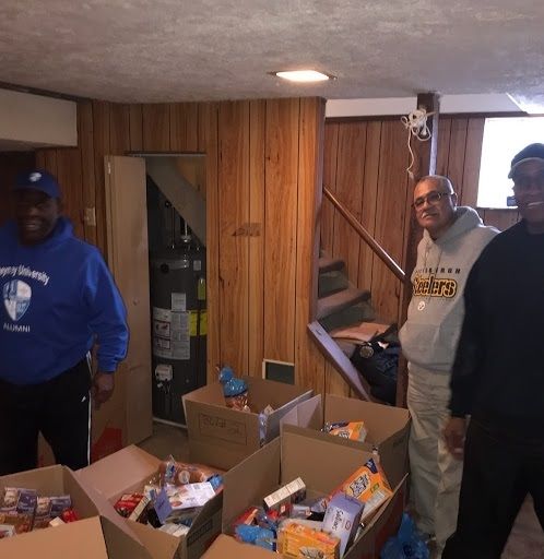Rich Alsberry, Reggie Smith, and Dan Robinson, collecting for our annual Holiday Food Drive. Every team or community is only as strong as it's weakest link. 